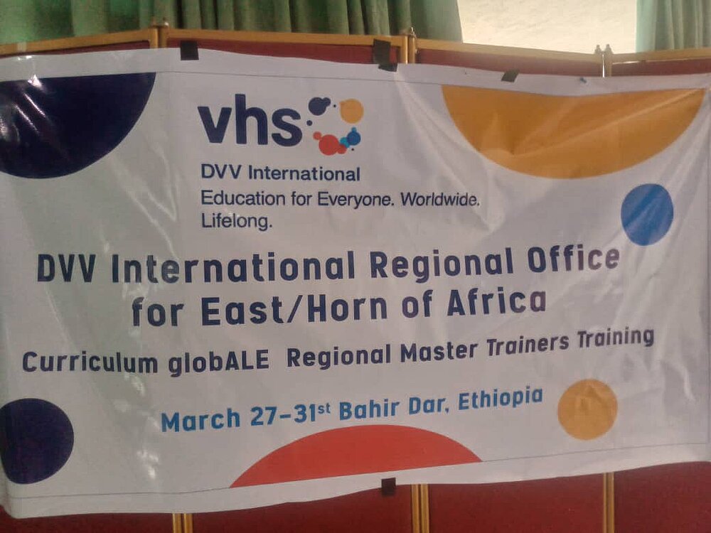 Board announcing training by DVV International