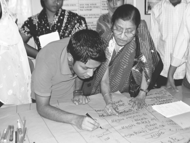 Neighbourhood Committee Members developing a pictorial monitoring chart